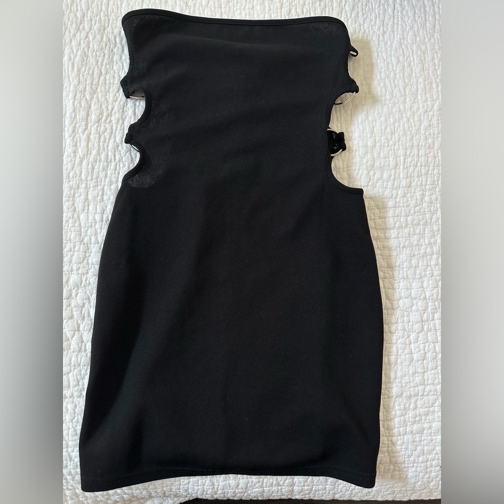 Black ring cut out dress.